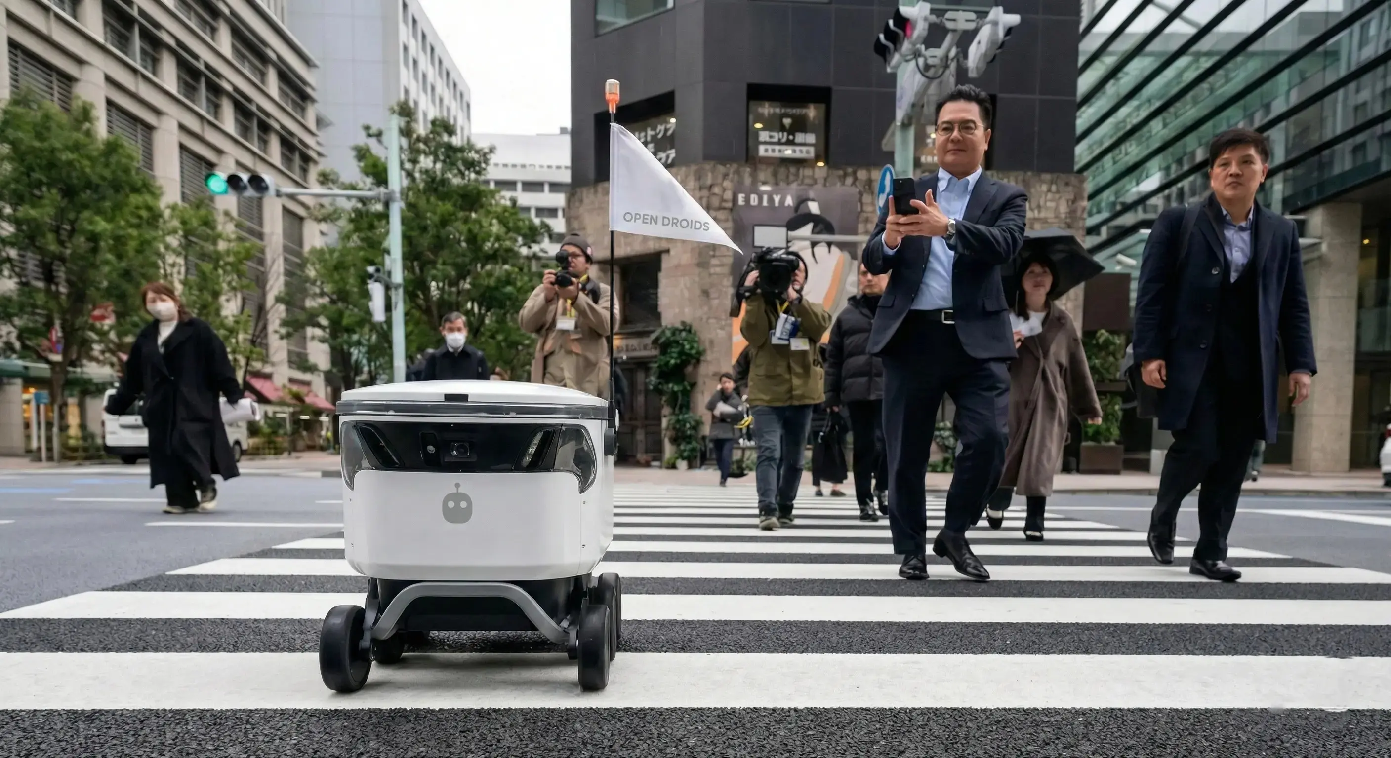 Droid sidewalk delivery robot on an urban route