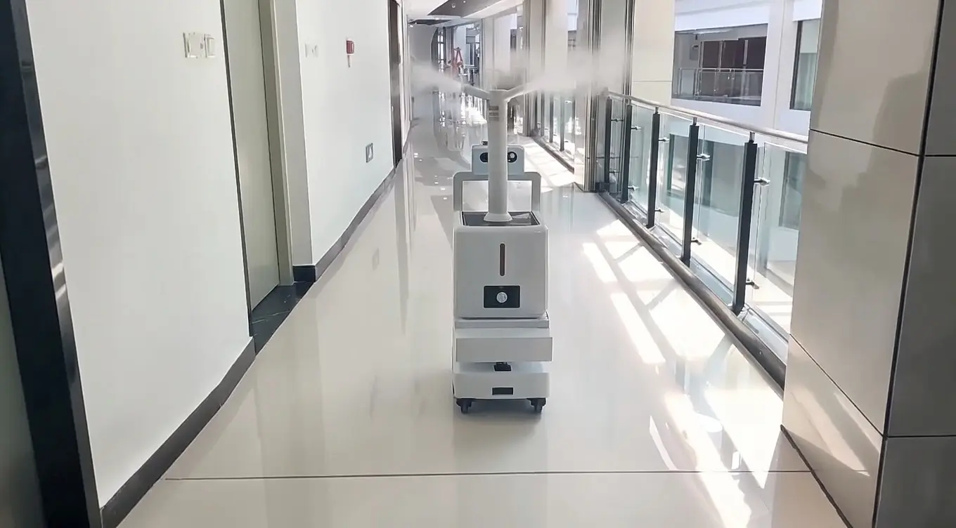Droid UV-C disinfection robot mid-cycle in an empty patient room
